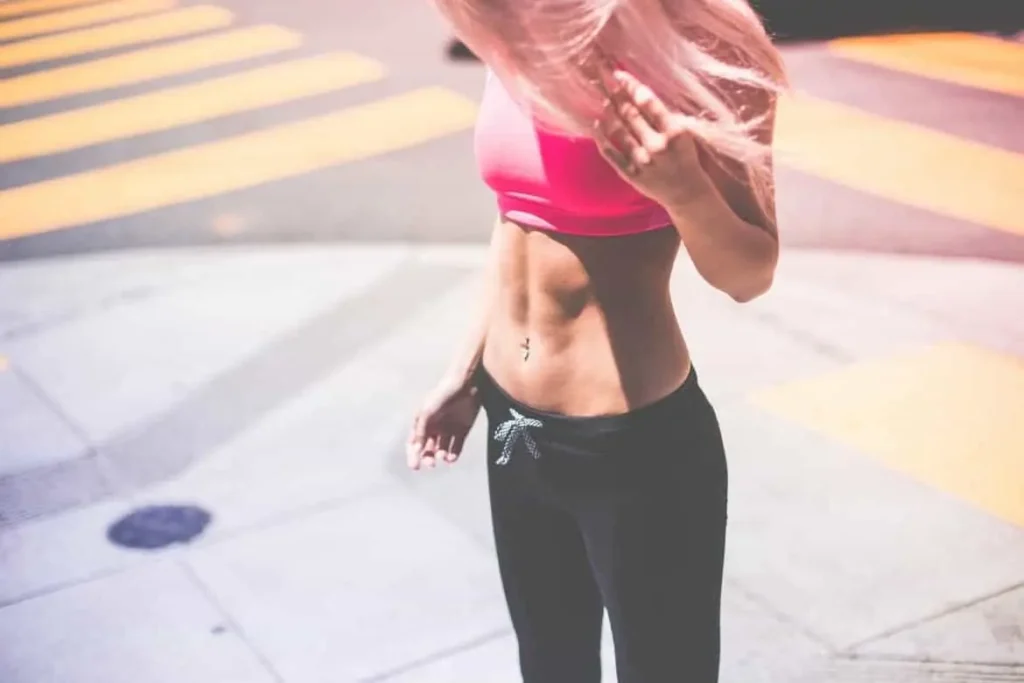Woman with toned stomach after LA-EMS Body Sculpting Treatment Marlow